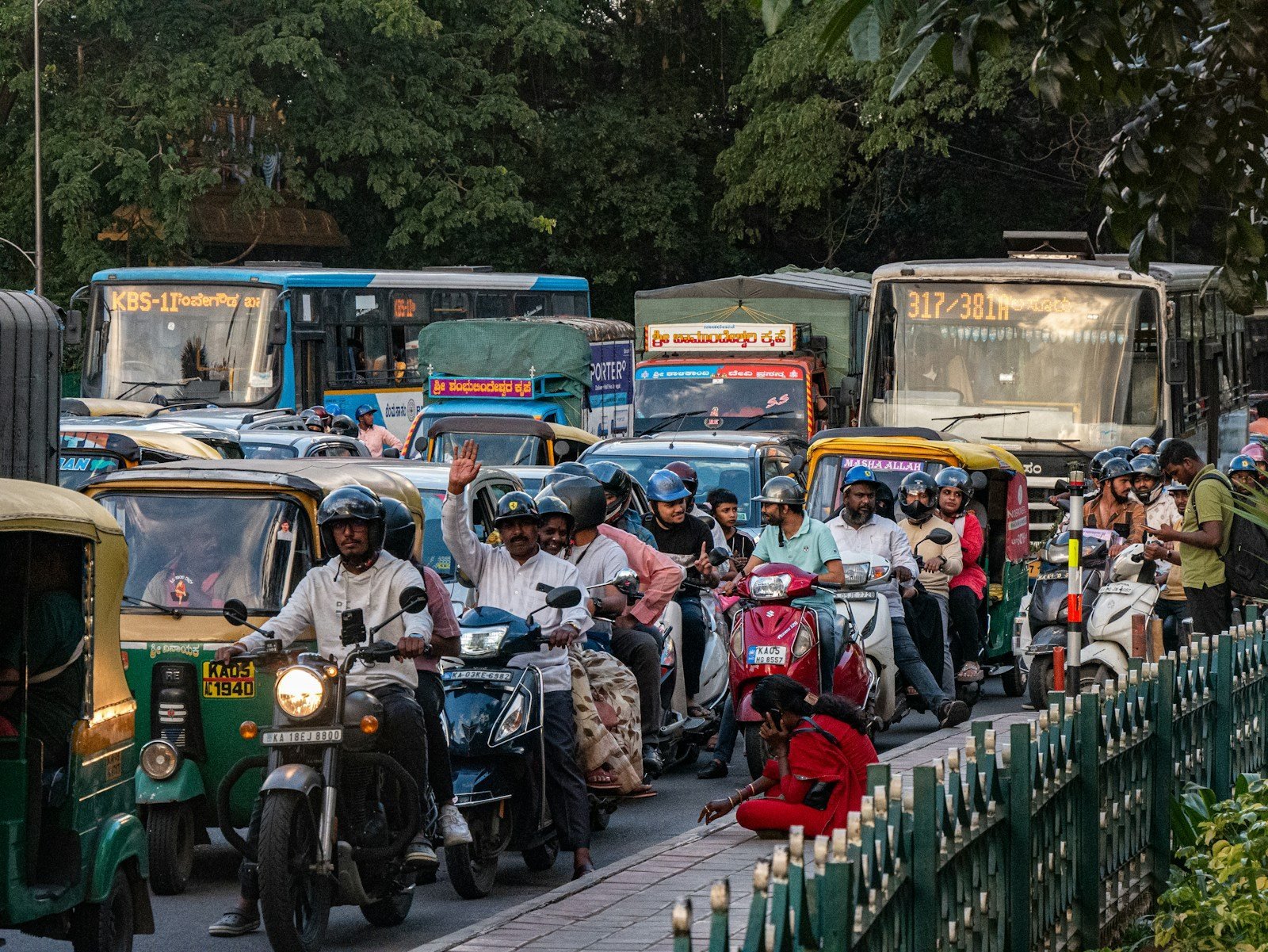 Bengaluru traffic with scooters, autos and city buses